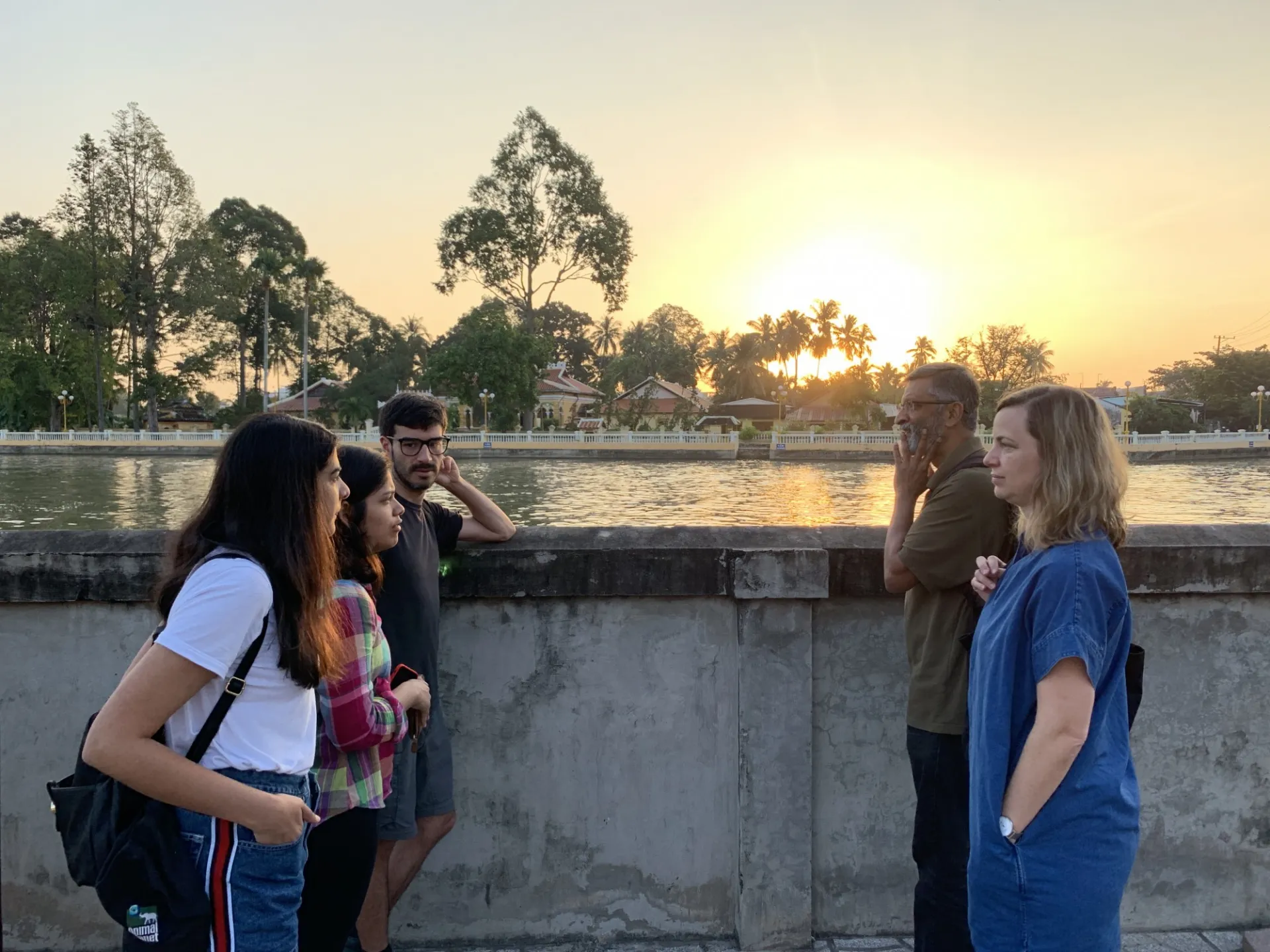 PROFESSORS ORFF AND DACUNHA TALK TO STUDENTS IN FRONT OF A BUDDHIST PAGODA.jpg