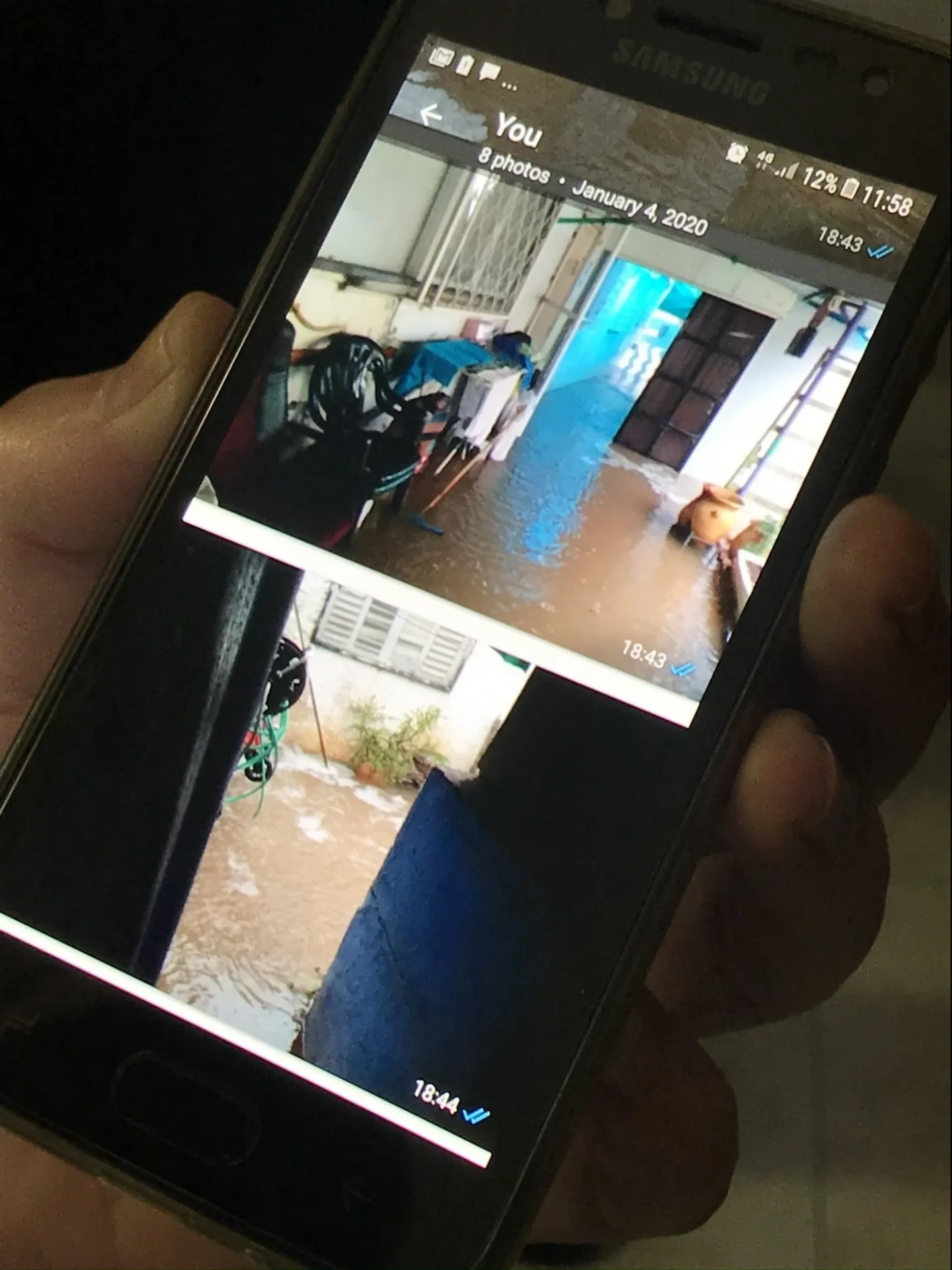 Urban Design Director, Kate Orff, meeting with resident whose home was flooded the day prior from historic rains
