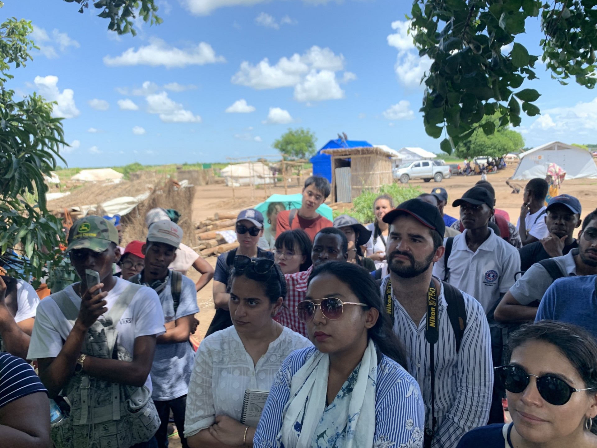 Students visiting an IOM relocation camp